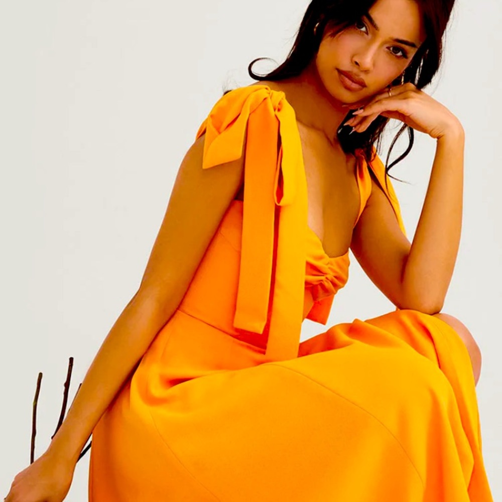 Brand new with tags yellow fit and flare dress with  side slit, never been worn